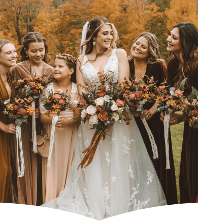 Beautiful wedding scene with bride and bridesmaids in autumn setting