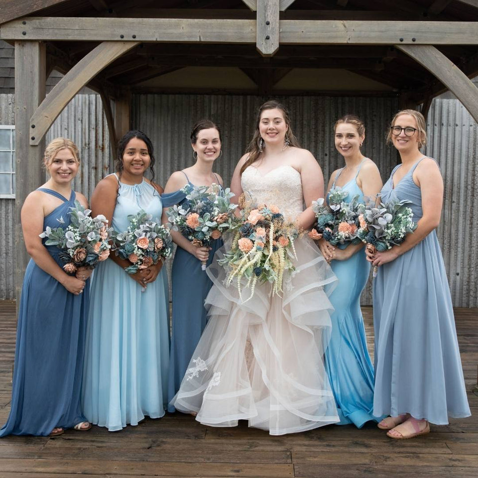 A bride holding her four free sampler flowers in her hand