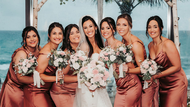 Beautiful wedding scene with bride and bridesmaids in autumn setting